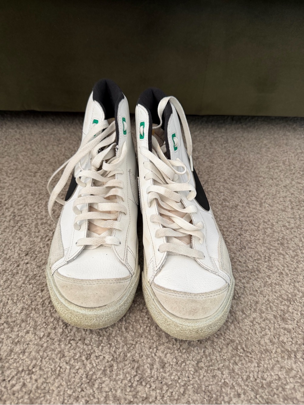 Nike White High-Top Sneakers with Black Swoosh and Green Eyelets